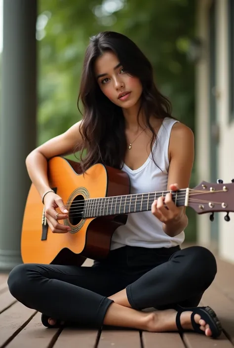 20-year-old Brazilian woman with long dark hair wearing black leggings and black high-heeled sandals with white sleeveless t-shirt sitting on the porch playing the guitar 