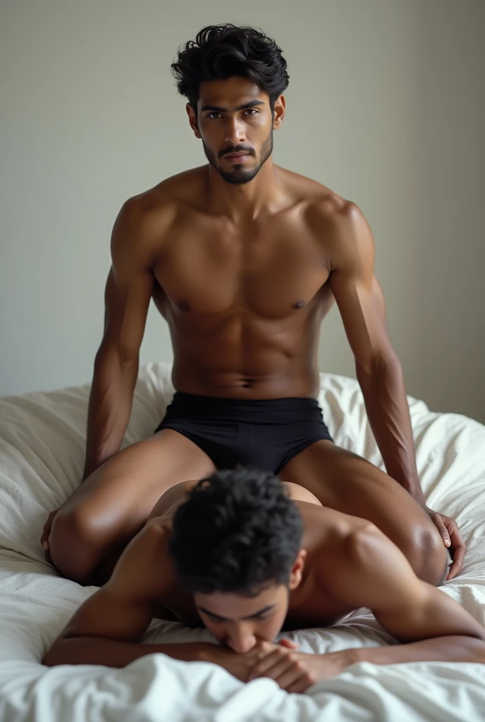 Sri lankan teen shirtless handsome guy wearing a fit underwear is sitting on the top of another guys back who is crawling on all fours on a bed