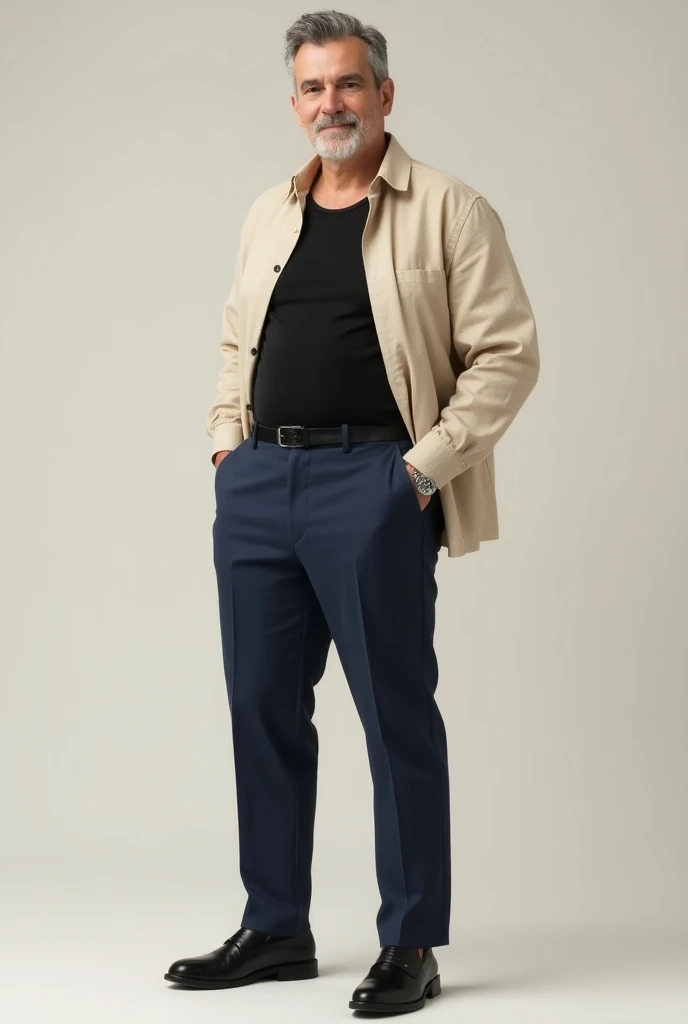 Man wearing navy blue dress pants with black dress shoes with black tank top and a beige linen shirt over the top