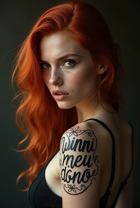 Redheaded woman with a tattoo written on it "vinni meu dono" 