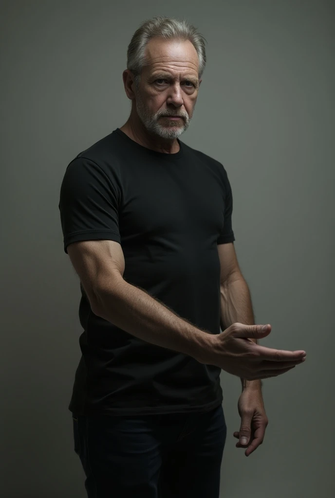 50-year-old man in a black t-shirt with a well-elongated left arm stretched forward pointing in an image facing the right 