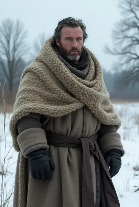 a north European guy from the 14th century wearing thick rag in the snow