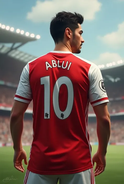 Mesut ozil wears an arsenal jersey in number 10 says "Abdu" in back