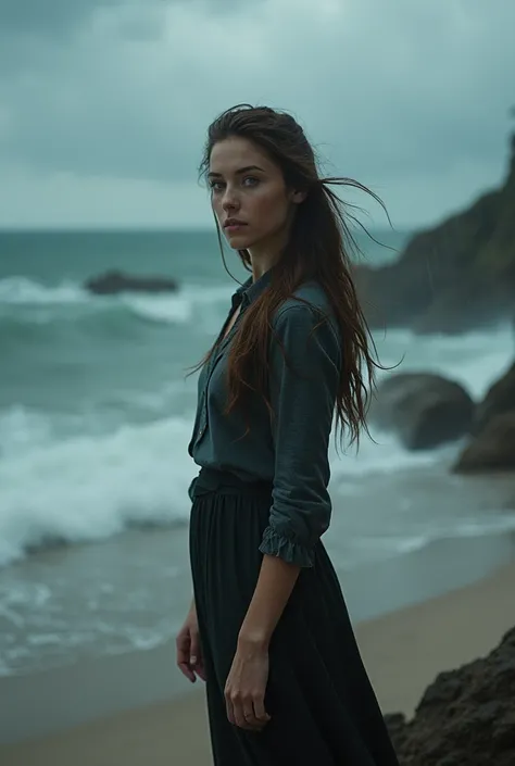 18-year-old brunette woman with green eyes at the edge of a beach in rainy weather