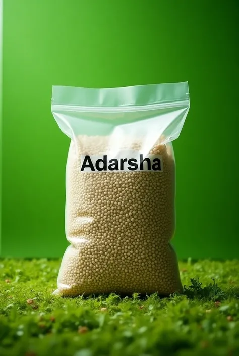 A plastic sack sealed with ADARSHA FEED written on it which background is green