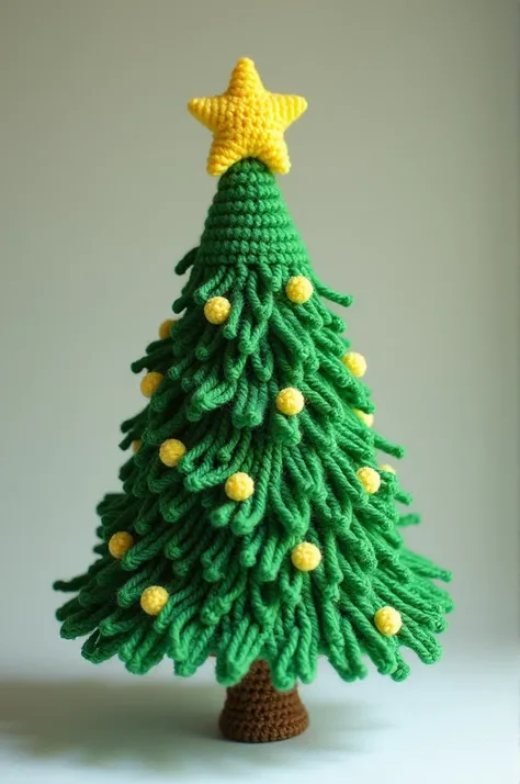 An amigurumi of a crocheted Christmas tree 