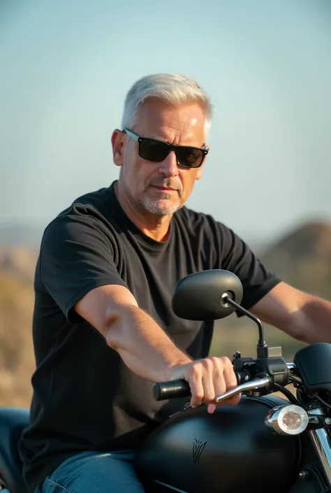 A white man with short white hair  ,   wearing sunglasses with a black motorcycle on the side
