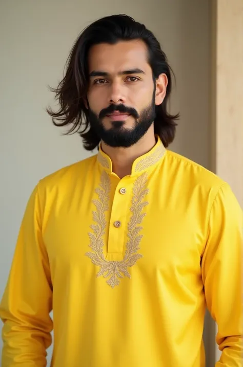 A men wearing lemon color panjabi has beard and long half hair