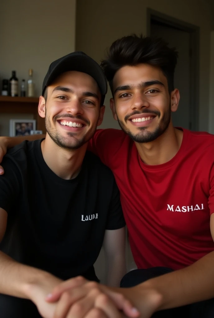 Two Best friend sit in room black red shirt, black cap , red watch . write name on shirt one is " Zain "  , second name on shirt "Mashal"