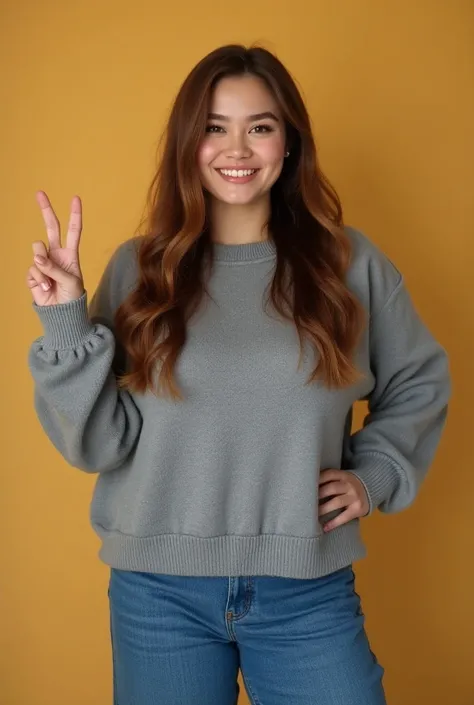 A fat girl with hazel hair and brown eyes wears a gray sweater and wide jeans she smiles and shows the peace sign with her right hand