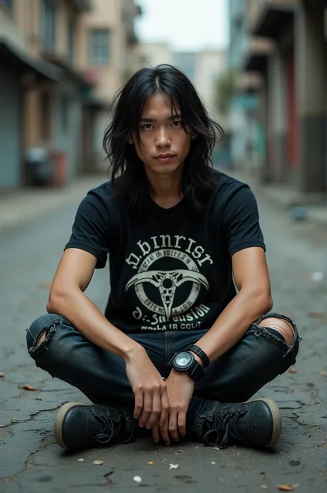 asian metalhead guy sit on the street pavement looking to the camera