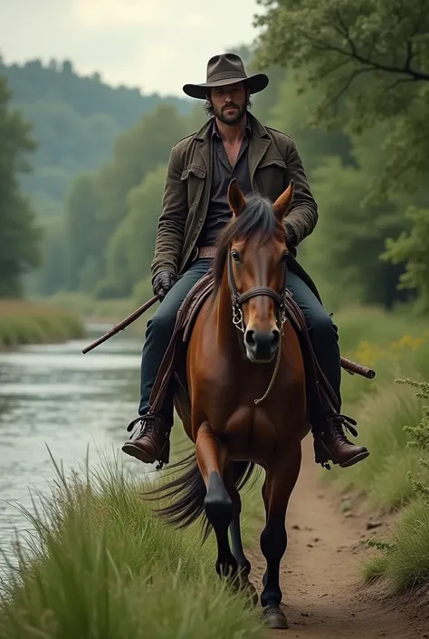 Handsome horseman in a hat riding the banks of a river