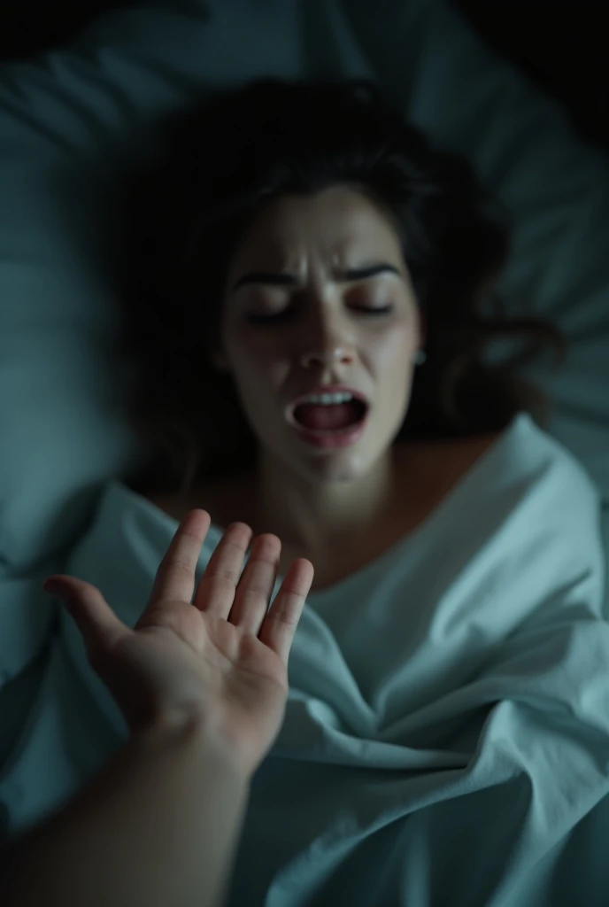 a hand in the foreground touching a woman who wakes up from a nightmare. Realistic scene