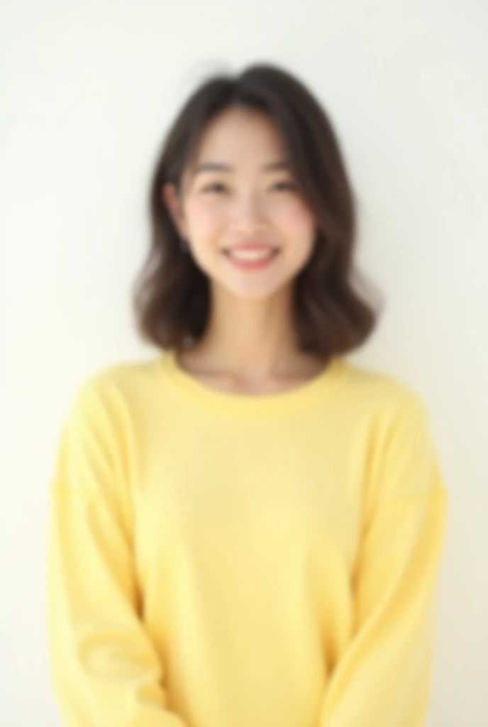 young woman wearing pastel yellow shirt on a white background in front
