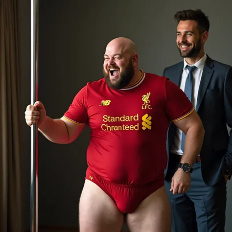 A bald fat man with no beard man, wearing a Liverpool red jersey pole dancing in underwear. And a handsome guy with beard and suit standing and laughing near him