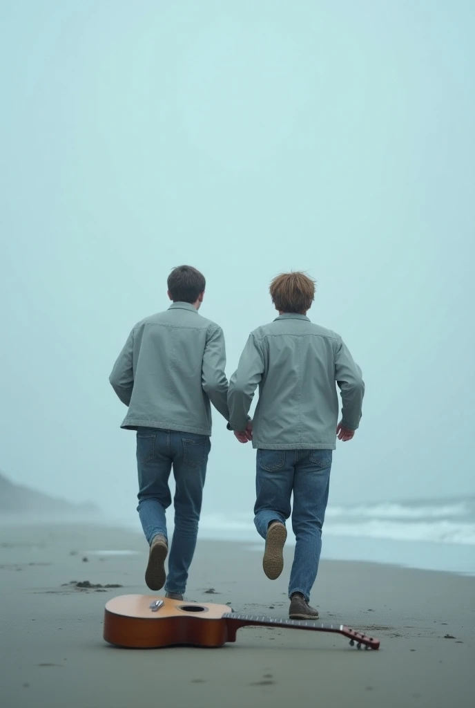  are two 30-year-old young men who are Saqqan at the end of a beach and they have a guitar sitting on the ground while they are running to the sky .  in a very winter weather and heavy rains. They are far from seeing us as scenes of a very beautiful pictur...