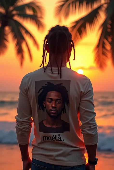 Man standing near the beach watching the sunset that has two long rastas at the back of his head and his skin color is black with a smartwatch on his wrist and wears a long  hand shirt that written  MŲṢ̌À at the back and a portrait of one man with angry fa...