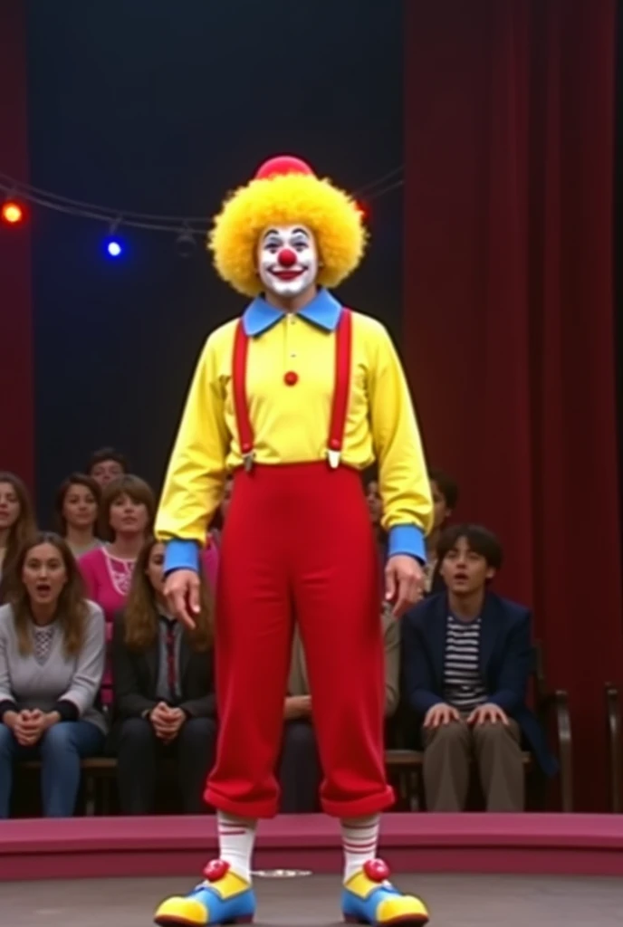 A person who plays a clown who hosts an 80s television show clown wearing a wig with hair only on the sides, a tidy yellow wig, wearing a long yellow blouse underneath, a long yellow blouse over the top, a long red gardener, shoulder strap, blue, yellow an...