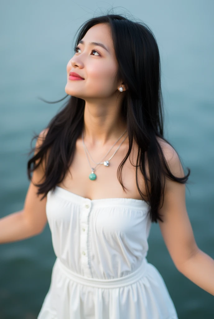 Medium shot a vibrant young Asian woman stands with her arms outstretched, her head tilted slightly to the left. She is dressed in a white strapless top, adorned with a silver necklace and earrings. Her long dark hair cascades over her shoulders, adding a ...