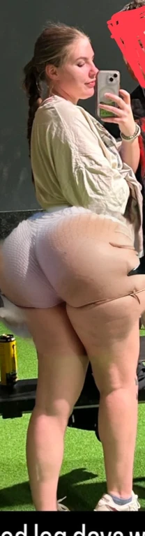 there is a woman that is standing in the grass with a cell phone, booty shorts, thighs close up, uhd candid photo of dirty, big booty, insanely inflated hips, pawg, middle shot waist up, waist - shot, in shorts, close-up shot from behind, thighs, exposed t...