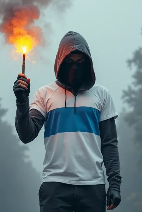 A hooded man wearing a white flag in one hand and a flare in the other and wearing a white t-shirt with a horizontal blue stripe whose face is covered with a black mask