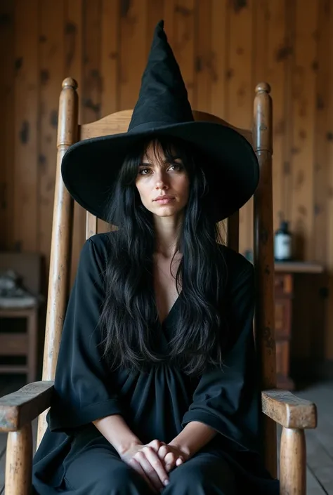 Photo of a black-haired woman, sitting in a rocking chair, disheveled, dressed as a witch, with her witch hat, in a lonely cabin. Clear, detailed image, daylight, photo realistic.