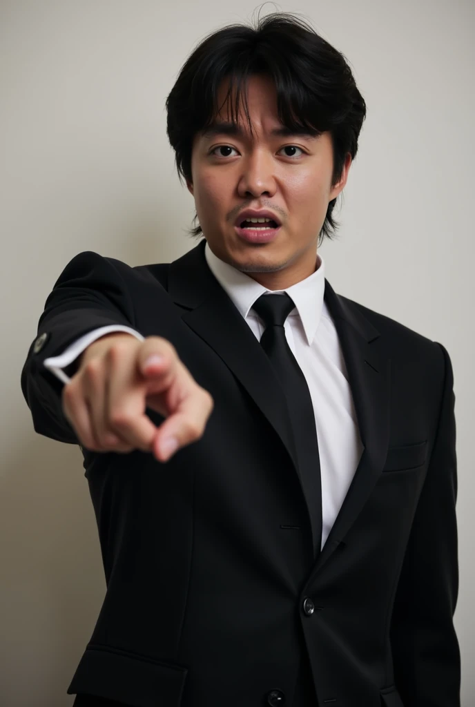 A handsome japanese male with a small face and goatie in a business suit angry and glaring at the viewer. pointing at the viewer. 