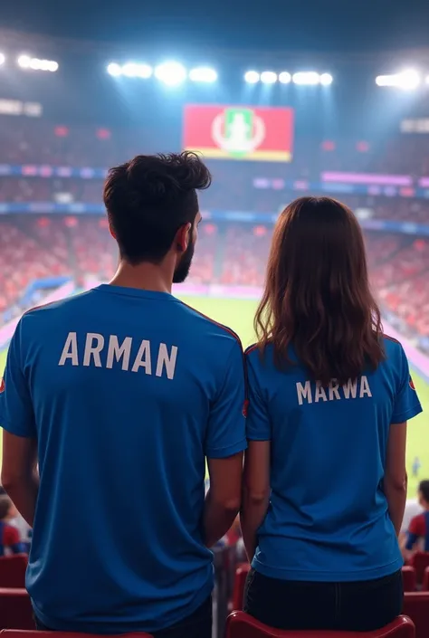 A man and a girl watching Afghanistan match, wearing Afghanistan blue jersey, names on Arman and Marwa