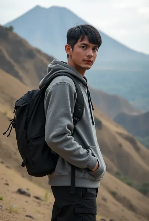 Real human. Photo, bodynfacung forward, Aziz is Indonesian young man, short straight black hair, white skin, black expressive eyes, medium body, wearing grey hoodie, black cargo pant, carrying black backpack, he is standing watching serious, on the Sandy h...