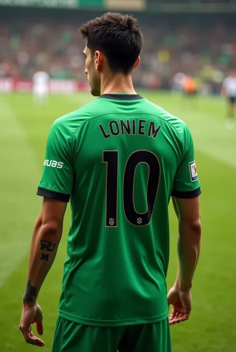 A football player wearing a number 10 shirt whose name is written on the back of the shirt 
The color of the green shirt is MAHDI 