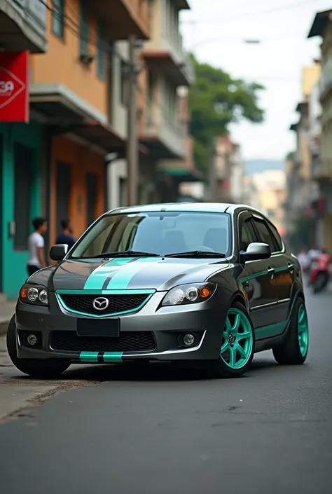 Mazda Allegro gray hatchback model 2002 short with turquoise green rims and turquoise green stripes with profile photo taken on a Colombian street 
