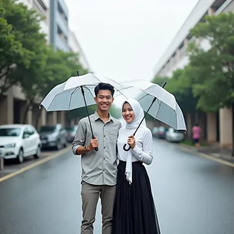 The image shows a young  Indonesian couple standing in an empty street with umbrellas. The woman is wearing a white hijab, luxury dress and a black skirt, while the man is wearing casual clothes. They are both smiling and looking at the camera. The street ...