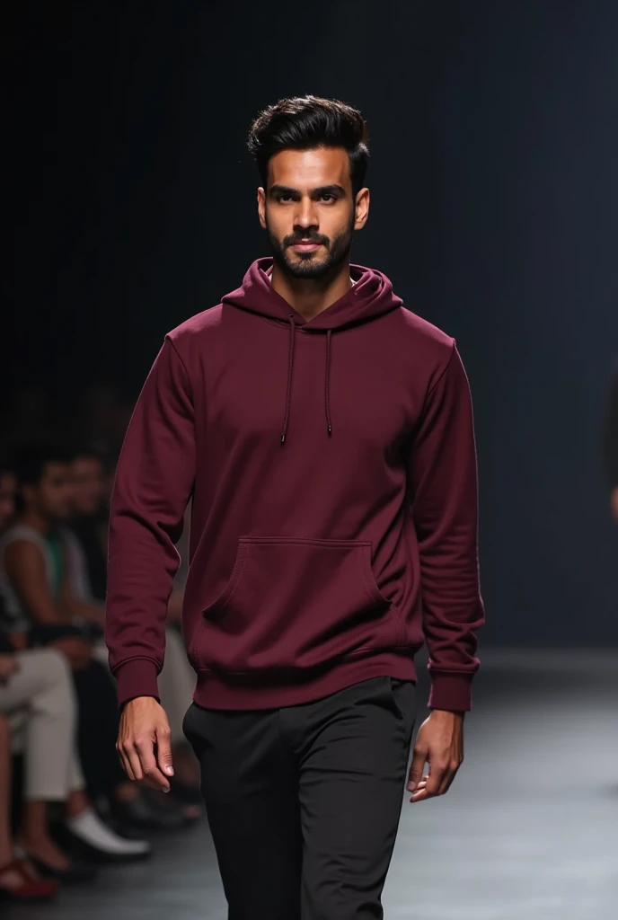 An Indian model man wearing dark mehroon plain hoodie without no laces(thread) of cap walking on stage show