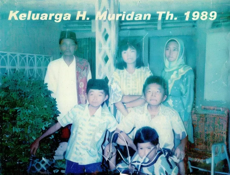 there are a group of people standing together in a room, old picture, scanned in, scanned, hi-res scan, hi - res scan, old photo, in 1 9 8 5, an indonesian family portrait, album cover, 1996), photo 1 9 9 0 s, 1990s photo, scanned 2400 dpi