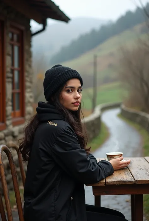 A beautiful girl, Trishna written on back   wearing black winter cloth sitting on a table, village tea shop,hill road.