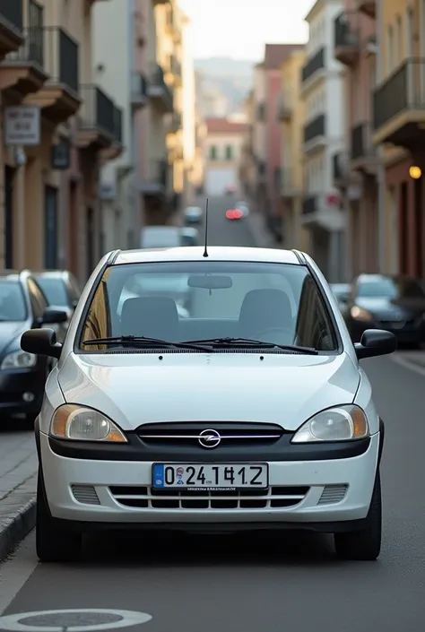 A white opel corsa 2004 model hatch back
