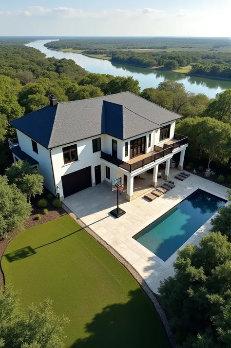 A 2 story mansion worth about $6,000,000 on the Colorado River in stiner ranch austin Texas about 3,343 square foot with a basketball hoop near the garage with a lot of flat grass in the front and back yard that is made of gray concrete with dark gray roof...