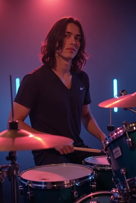 His hair was long, he was a man, he was a drummer and he was playing the drums. Not very tan skin, black hair, charming and cool face, around 18 years old, has a cool aura in the picture. Hes playing the drums in the picture.