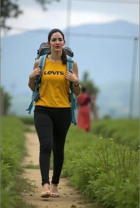 Full-length photo of a woman walking along a dirt path.

The woman is light-skinned and has dark brown, shoulder-length hair in a ponytail. She is wearing a mustard yellow tank top with "Levis" written in large, dark capital letters across the front. She i...