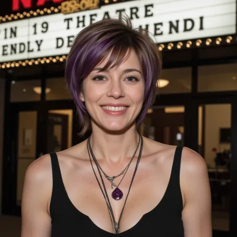 woman in her early 40s, stylish pixie cut with purple highlights, wearing bohemian-style clothing, standing in front of a vintage theater marquee