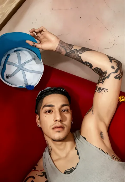 Crooked man lying on a red couch with a hat on his head, with tattoos, andres rios, inspired by Randy Vargas , profile picture, Using Shipibo Tattoos, Cantor Maluma, André Gonzalez, young spanish, 1614572159, with paint, Sidney Lugo, profile picture,  extr...