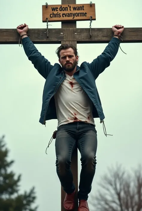 A hyper realistic image of Chris Evans Crucified on a tall wooden cross by his own fans who have turned against him and have Crucified him to the cross. He wears a dark blue bomber jacket over a white t-shirt and black jeans. He is tied to the cross with r...