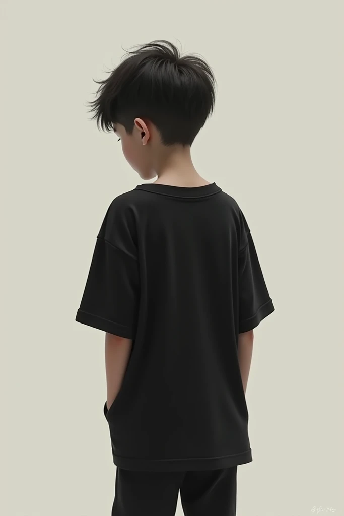 A boy wearing a black over-sized t-shirt turns his back and poses