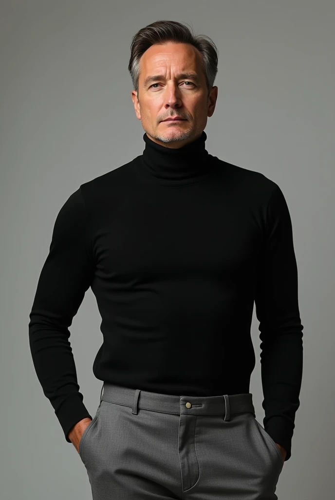 A man wearing grey chinos with black turtleneck 