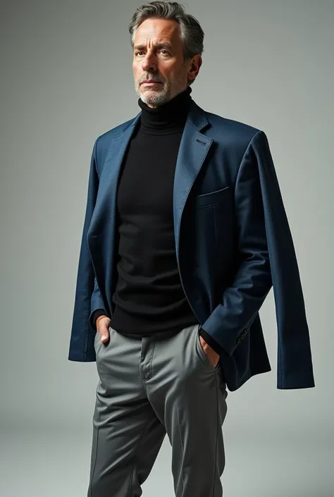 A man wearing grey chinos with black turtleneck and a blue jeans jacket