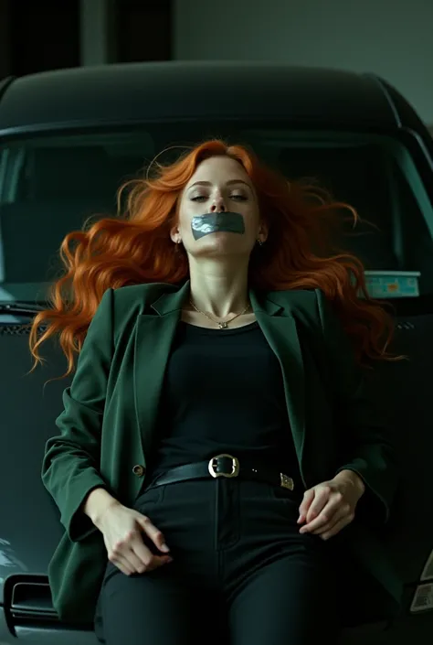 Scarlet johansson wearing black pants and black t-shirt from wool to her neck with green business jacket long orange hair found lying down on car trunk hands hidden in her back mouth taped by silver duct tape in dark parking lot eyes closed