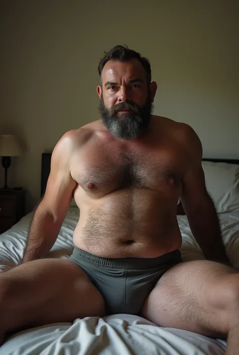 Make a 45 years old hot hairy fat guy sitting on bed only wearing boxers and have a huge dick and a lot of body hair with his legs opened