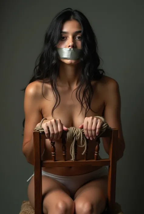 an indian girl and big breasts with her hands are tied up with rope at back of the chair,her mouth was covered with duct tape at chair,her legs are tied up at chair,naked