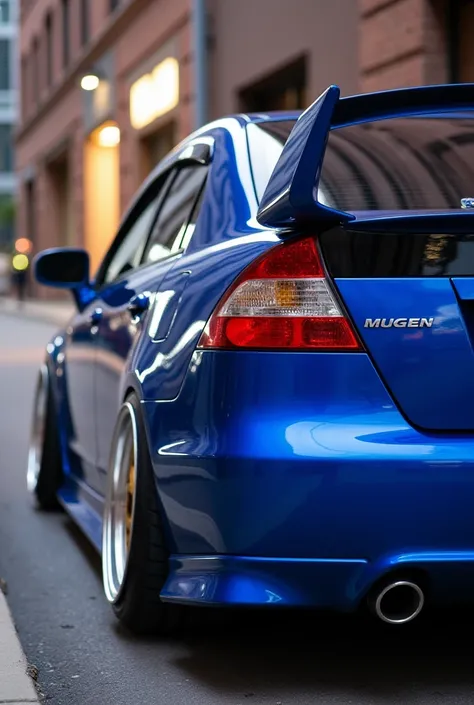 Civic 2006 blue with Mugen spoiler and luxury wheels
