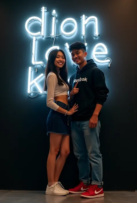 

" Indonesian couple with surreal image ,  men and women in contemporary style .  Women with black long black hair ,  wearing tight casual top and navy blue miniskirt . Man wearing Reebok hoodie , blue jeans, and red Jordan shoes .  Black wall background ...